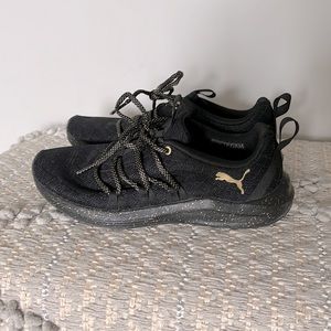 Puma black and gold sneakers size 6.5